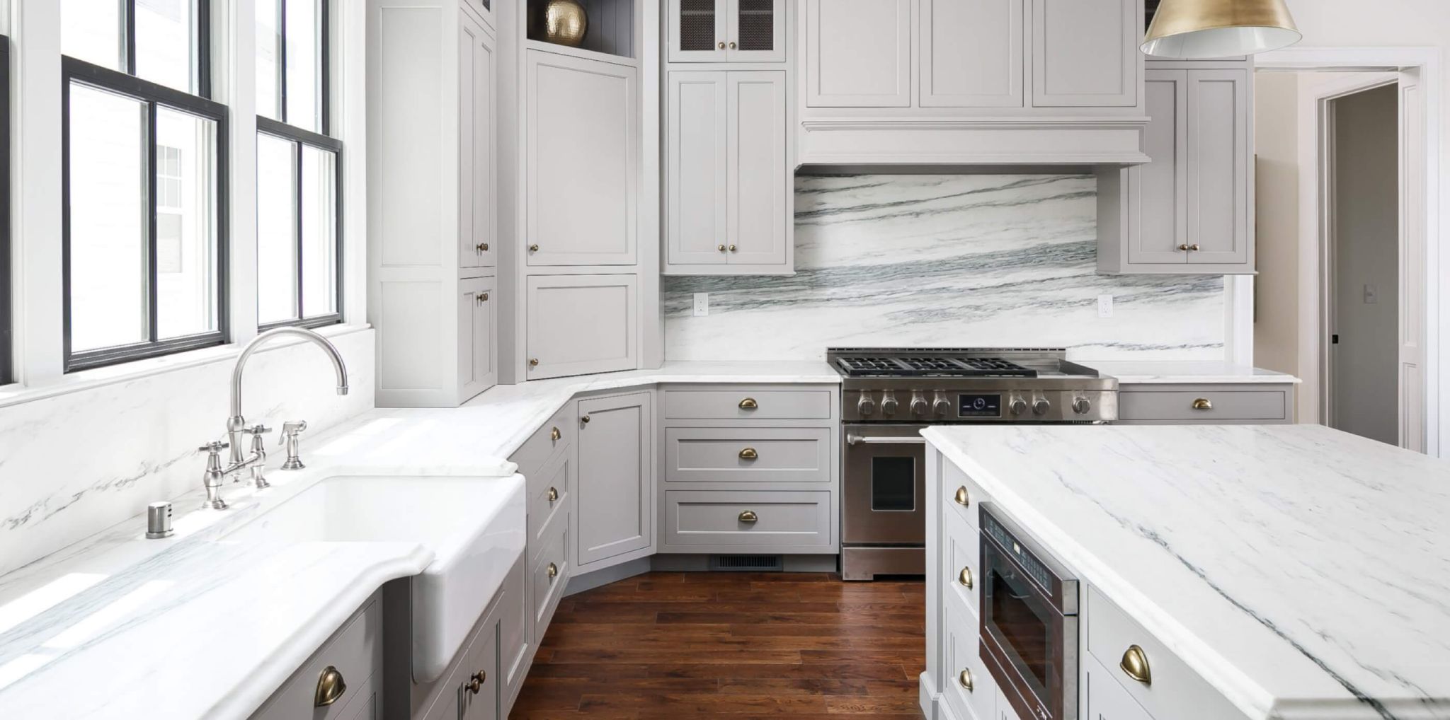 A kitchen with stone countertops fabricated by Trademark Universal Stone